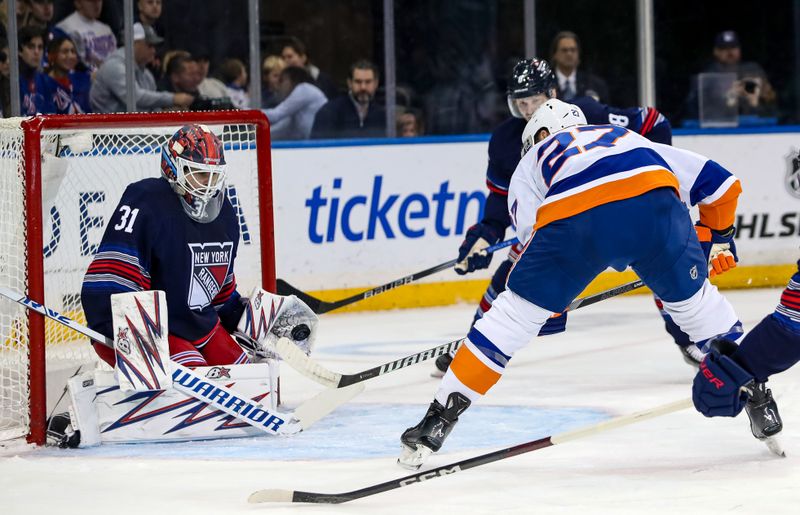 Nov 3, 2024; New York, New York, USA; New York Rangers goalie Igor Shesterkin (31) makes a glove save on a shot from New York Islanders left wing Anders Lee (27) during the second period at Madison Square Garden. Mandatory Credit: Danny Wild-Imagn Images