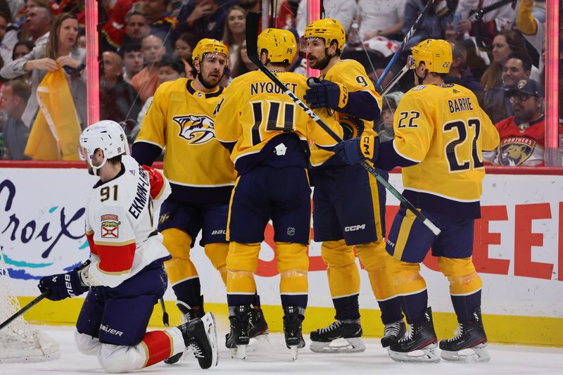 Mar 21, 2024; Sunrise, Florida, USA; Nashville Predators center Gustav Nyquist (14) celebrates with teammates after scoring against the Florida Panthers during the first period at Amerant Bank Arena. Mandatory Credit: Sam Navarro-USA TODAY Sports