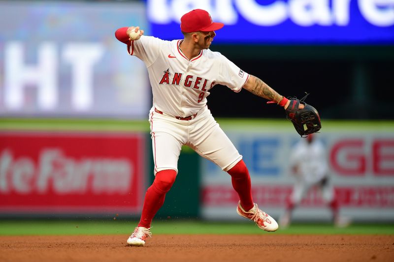 Jun 7, 2024; Anaheim, California, USA; Los Angeles Angels shortstop Zach Neto (9) throws to first for the out against Houston Astros outfielder Jake Meyers (6) during the fourth inning at Angel Stadium. Mandatory Credit: Gary A. Vasquez-USA TODAY Sports