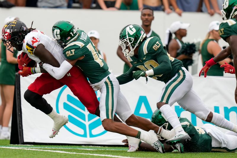 Sep 10, 2022; Charlotte, North Carolina, USA; Maryland Terrapins wide receiver Dontay Demus Jr. (7) is tackled by Charlotte 49ers safety Steven Parker (14) during the second quarter at Jerry Richardson Stadium. Mandatory Credit: Jim Dedmon-USA TODAY Sports