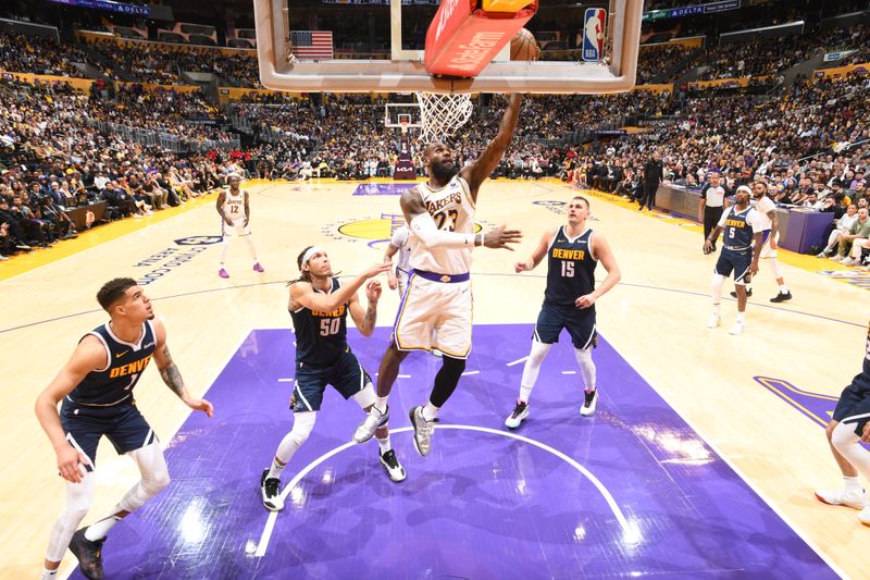 LOS ANGELES, CA - APRIL 27: LeBron James #23 of the Los Angeles Lakers drives to the basket during the game against the Denver Nuggets during Round 1 Game 4 of the 2024 NBA Playoffs on April 27, 2024 at Crypto.Com Arena in Los Angeles, California. NOTE TO USER: User expressly acknowledges and agrees that, by downloading and/or using this Photograph, user is consenting to the terms and conditions of the Getty Images License Agreement. Mandatory Copyright Notice: Copyright 2024 NBAE (Photo by Andrew D. Bernstein/NBAE via Getty Images)