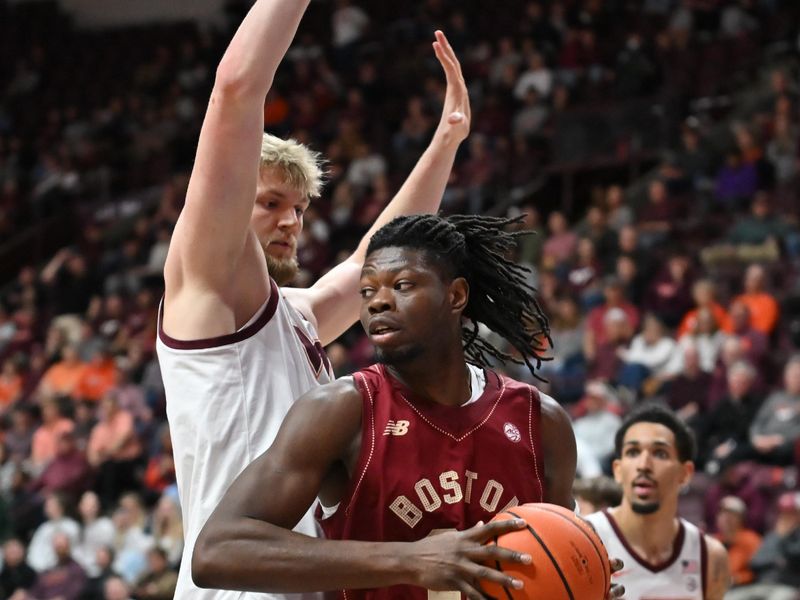 Mar 3, 2026; Blacksburg, Virginia, USA;  Boston College Eagles forward Jayden Hastings (22) looks to pass the balll as Virginia Tech Hokies center Antonio Dorn (77) defends during the first half at Cassell Coliseum. Mandatory Credit: Brian Bishop-Imagn Images