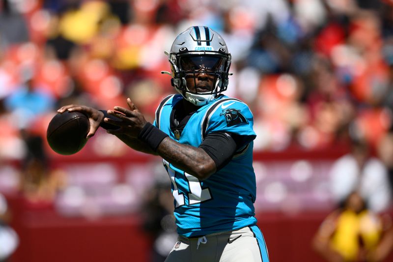 Carolina Panthers quarterback PJ Walker (11) in action during the first half of a preseason NFL football game against the Washington Commanders, Saturday, Aug. 13, 2022, in Landover, Md. (AP Photo/Nick Wass)