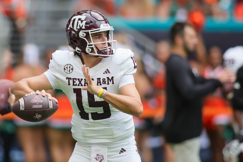 Sep 9, 2023; Miami Gardens, Florida, USA; Texas A&M Aggies quarterback Conner Weigman (15) throws the football during warmups prior to the game against the Miami Hurricanes at Hard Rock Stadium. Mandatory Credit: Sam Navarro-USA TODAY Sports