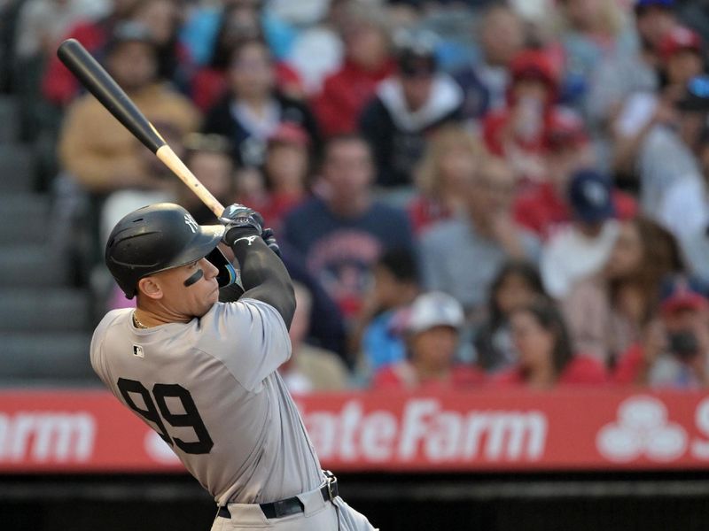 May 30, 2024; Anaheim, California, USA;  New York Yankees center fielder Aaron Judge (99) hits a two-run home run scoring right fielder Juan Soto (22) in the fourth inning against the Los Angeles Angels at Angel Stadium. Mandatory Credit: Jayne Kamin-Oncea-USA TODAY Sports