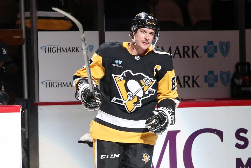 Oct 31, 2024; Pittsburgh, Pennsylvania, USA;  Pittsburgh Penguins center Sidney Crosby (87) reacts to being named first star of the game after scoring the game winning goal against the Anaheim Ducks in overtime at PPG Paints Arena. Mandatory Credit: Charles LeClaire-Imagn Images