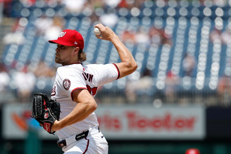 Jul 21, 2024; Washington, District of Columbia, USA; Washington Nationals starting pitcher Jake Irvin (27) pitches against the Cincinnati Reds during the second inning at Nationals Park. Mandatory Credit: Geoff Burke-USA TODAY Sports
