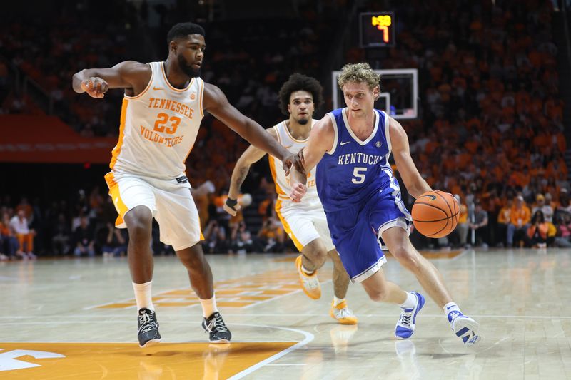 Jan 17, 2026; Knoxville, Tennessee, USA;  Kentucky Wildcats guard Collin Chandler (5) moves the ball against Tennessee Volunteers forward Jaylen Carey (23) during the second half at Thompson-Boling Arena at Food City Center. Mandatory Credit: Randy Sartin-Imagn Images