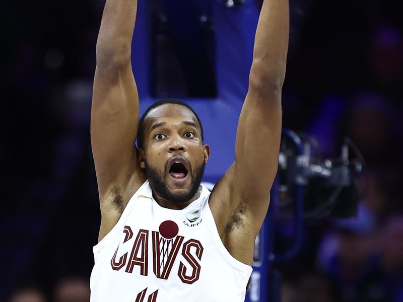 PHILADELPHIA, PENNSYLVANIA - FEBRUARY 23: Evan Mobley #4 of the Cleveland Cavaliers reaches for a rebound during the fourth quarter against the Philadelphia 76ers at the Wells Fargo Center on February 23, 2024 in Philadelphia, Pennsylvania. (Photo by Tim Nwachukwu/Getty Images)