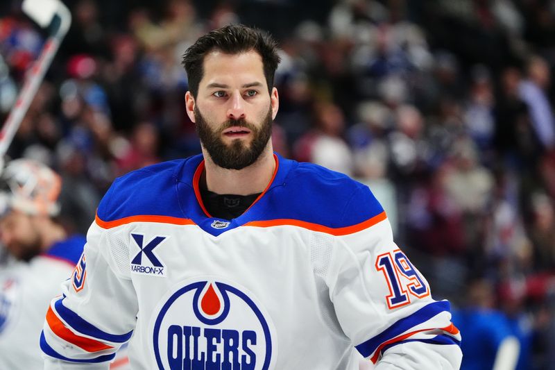 Nov 30, 2024; Denver, Colorado, USA; Edmonton Oilers center Adam Henrique (19) before the game against the Colorado Avalanche at Ball Arena. Mandatory Credit: Ron Chenoy-Imagn Images