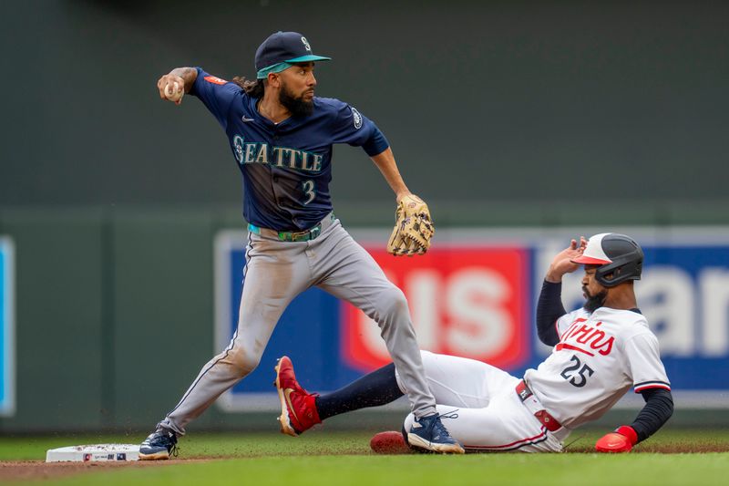 Jun 24, 2025; Minneapolis, Minnesota, USA; Seattle Mariners shortstop J.P. Crawford (3) forces out Minnesota Twins center fielder Byron Buxton (25) at second base and throws the ball to first base for a double in the first inning at Target Field. Mandatory Credit: Jesse Johnson-Imagn Images