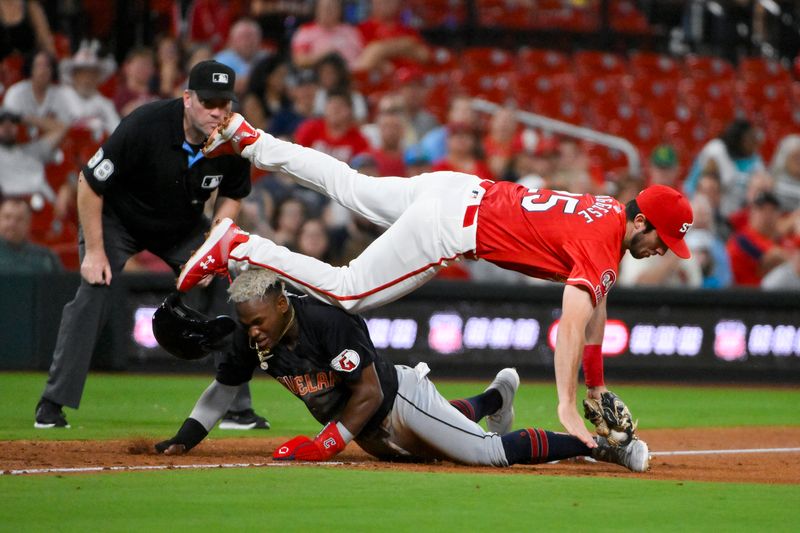 Sep 20, 2024; St. Louis, Missouri, USA; St. Louis Cardinals third baseman Thomas Saggese (25) leaps after tagging out Cleveland Guardians left fielder Angel Martinez (1) on a stolen base attempt during the seventh inning at Busch Stadium. Mandatory Credit: Jeff Curry-Imagn Images