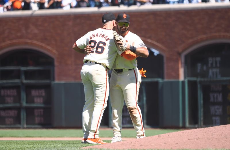 Jun 30, 2024; San Francisco, California, USA; San Francisco Giants third baseman Matt Chapman (26) hugs first baseman David Villar (32) after a win against the Los Angeles Dodgers at Oracle Park. Mandatory Credit: Kelley L Cox-USA TODAY Sports