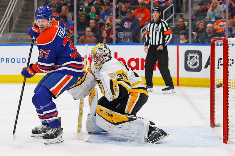 Mar 3, 2024; Edmonton, Alberta, CAN; Edmonton Oilers forward Warren Foegele (37) deflects s shot just wide of Pittsburgh Penguins goaltender Alex Nedeljkovic (39) during the first period at Rogers Place. Mandatory Credit: Perry Nelson-USA TODAY Sports