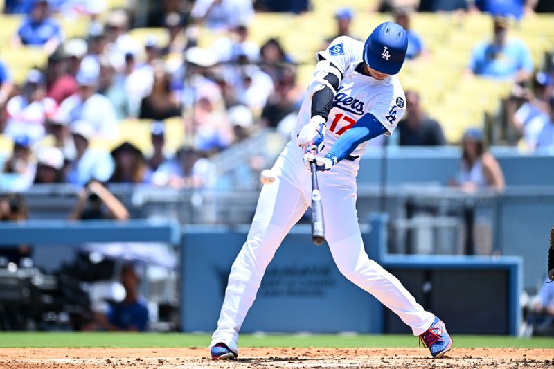 Jul 20, 2025; Los Angeles, California, USA; Los Angeles Dodgers designated hitter Shohei Ohtani (17) hits a two-run home run against the Milwaukee Brewers during the third inning of the game at Dodger Stadium. Mandatory Credit: Jonathan Hui-Imagn Images