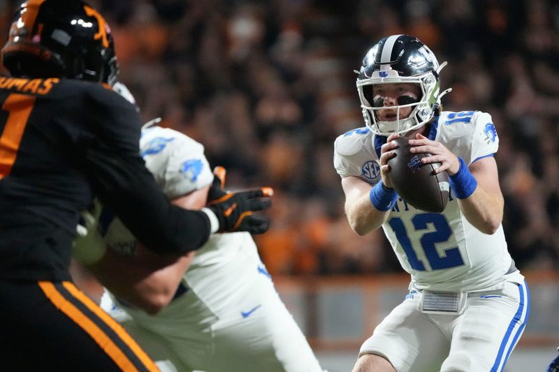Nov 2, 2024; Knoxville, Tennessee, USA; Kentucky Wildcats quarterback Brock Vandagriff (12) takes the snap against the Tennessee Volunteers during the first half at Neyland Stadium. Mandatory Credit: Saul Young/USA TODAY Network via Imagn Images
