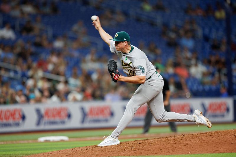 May 28, 2024; St. Petersburg, Florida, USA;  Oakland Athletics pitcher Mason Miller (19) throws a pitch  against the Tampa Bay Rays in the ninth inning at Tropicana Field. Mandatory Credit: Nathan Ray Seebeck-USA TODAY Sports