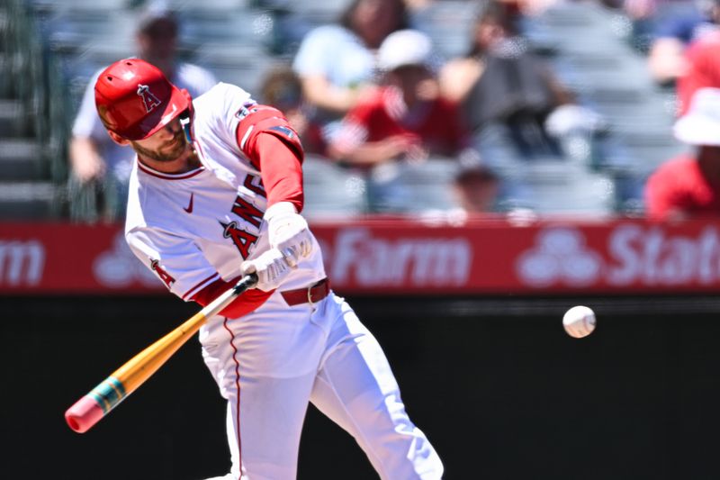 Aug 18, 2024; Anaheim, California, USA; Los Angeles Angels outfielder Taylor Ward (3) flies out against the Atlanta Braves during the third inning at Angel Stadium. Mandatory Credit: Jonathan Hui-USA TODAY Sports