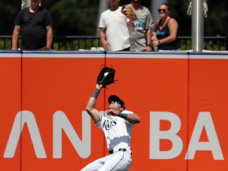 Apr 10, 2025; Tampa, Fl, USA;  Tampa Bay Rays outfielder Kameron Misner (26) catches a fly ball against the Los Angeles Angels during the sixth inning at George M. Steinbrenner Field. Mandatory Credit: Kim Klement Neitzel-Imagn Images