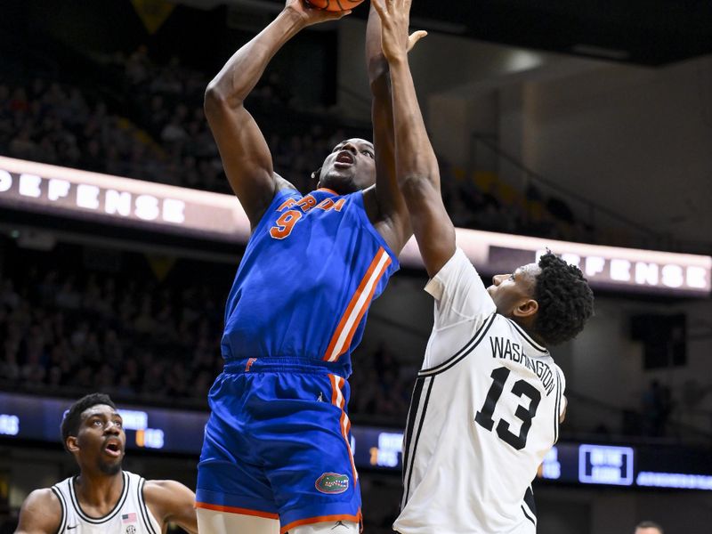 Jan 17, 2026; Nashville, Tennessee, USA;  Florida Gators center Rueben Chinyelu (9) dunks the ball over Vanderbilt Commodores forward Jalen Washington (13) during the first half at Memorial Gymnasium. Mandatory Credit: Steve Roberts-Imagn Images