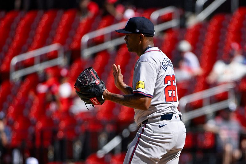 Jun 26, 2024; St. Louis, Missouri, USA;  Atlanta Braves relief pitcher Raisel Iglesias (26) reacts after the Braves defeated the St. Louis Cardinals at Busch Stadium. Mandatory Credit: Jeff Curry-USA TODAY Sports