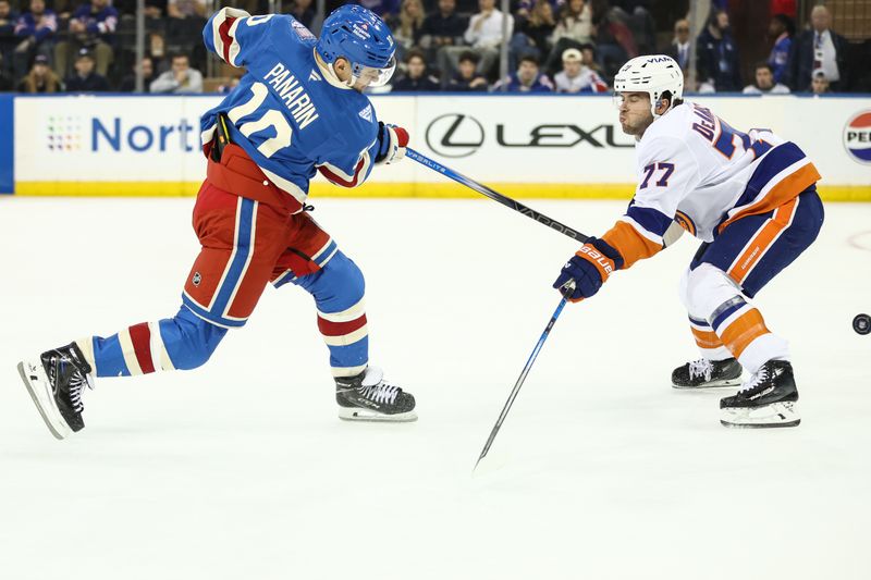 Nov 8, 2025; New York, New York, USA; New York Rangers left wing Artemi Panarin (10) shoots the puck past New York Islanders right wing Maxim Tsyplakov (7) in the first period at Madison Square Garden. Mandatory Credit: Wendell Cruz-Imagn Images
