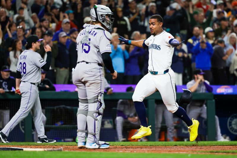 Sep 23, 2025; Seattle, Washington, USA; Seattle Mariners center fielder Julio Rodriguez (44) scores a run against the Colorado Rockies during the eighth inning at T-Mobile Park. Mandatory Credit: Joe Nicholson-Imagn Images