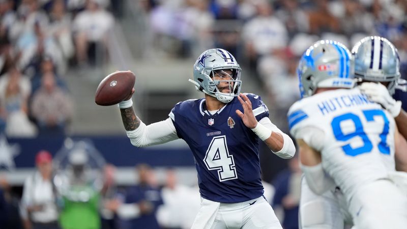 Dallas Cowboys quarterback Dak Prescott (4) throws a pass under pressure from Detroit Lions defensive end Aidan Hutchinson (97) in the first half of an NFL football game in Arlington, Texas, Sunday, Oct. 13, 2024. (AP Photo/LM Otero)