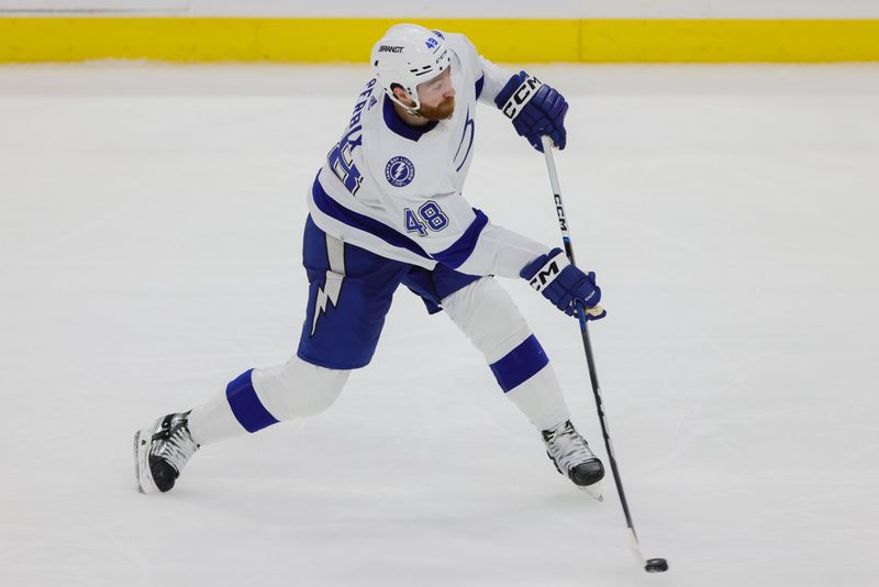 Apr 21, 2024; Sunrise, Florida, USA; Tampa Bay Lightning defenseman Nick Perbix (48) shoots the puck against the Florida Panthers during the third period in game one of the first round of the 2024 Stanley Cup Playoffs at Amerant Bank Arena. Mandatory Credit: Sam Navarro-USA TODAY Sports