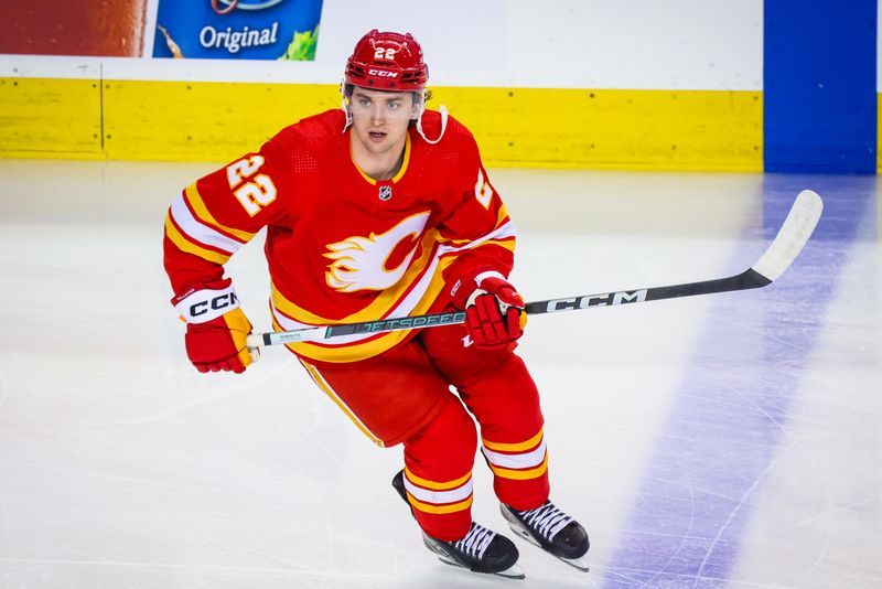 Mar 4, 2024; Calgary, Alberta, CAN; Calgary Flames center Jakob Pelletier (22) skates during the warmup period against the Seattle Kraken at Scotiabank Saddledome. Mandatory Credit: Sergei Belski-USA TODAY Sports