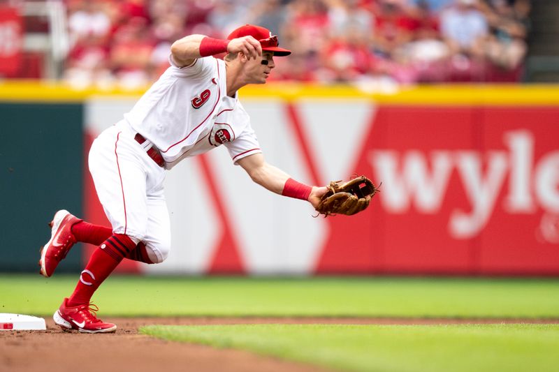 Aug 9, 2023; Cincinnati, OH, USA; Cincinnati Reds second baseman Matt McLain (9) fields a ground ball in the first inning of the MLB baseball game between Cincinnati Reds and Miami Marlins at Great American Ball Park in Cincinnati on Wednesday, Aug. 9, 2023.  Mandatory Credit: Albert Cesare-USA TODAY Sports