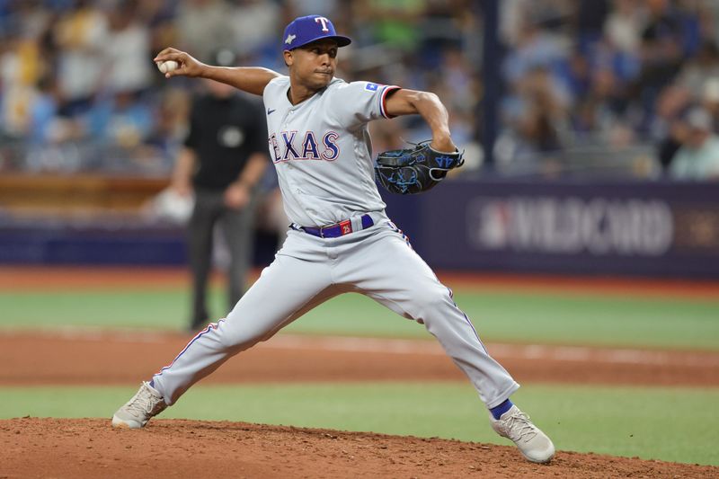 Oct 4, 2023; St. Petersburg, Florida, USA; Texas Rangers relief pitcher Jose Leclerc (25) pitches against the Tampa Bay Rays in the ninth inning during game two of the Wildcard series for the 2023 MLB playoffs at Tropicana Field. Mandatory Credit: Nathan Ray Seebeck-USA TODAY Sports