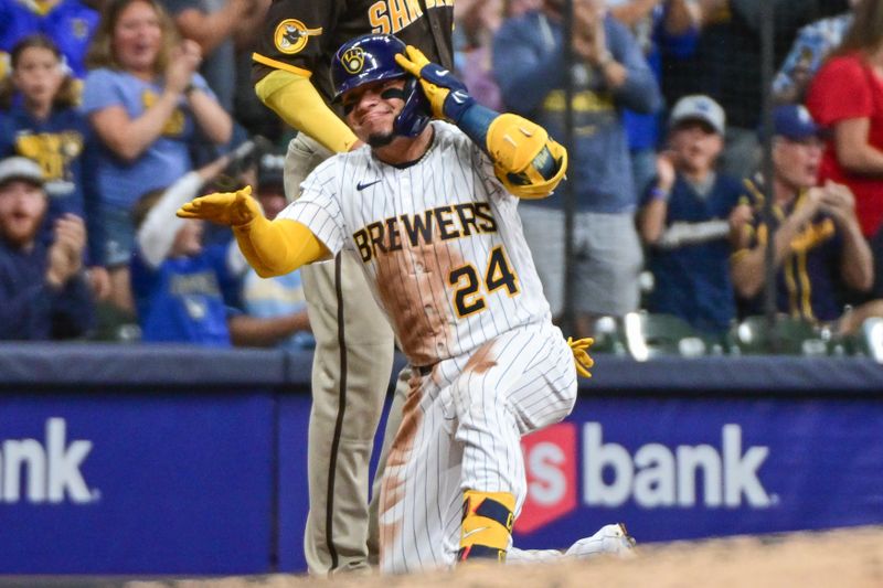 Aug 26, 2023; Milwaukee, Wisconsin, USA; Milwaukee Brewers catcher William Contreras (24) reacts after hitting a triple to drive in two runs in the fifth inning against the San Diego Padres at American Family Field. Mandatory Credit: Benny Sieu-USA TODAY Sports