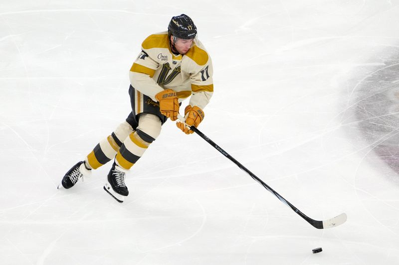 Mar 21, 2024; Las Vegas, Nevada, USA; Vegas Golden Knights defenseman Ben Hutton (17) skates against the Seattle Kraken during the first period at T-Mobile Arena. Mandatory Credit: Stephen R. Sylvanie-USA TODAY Sports