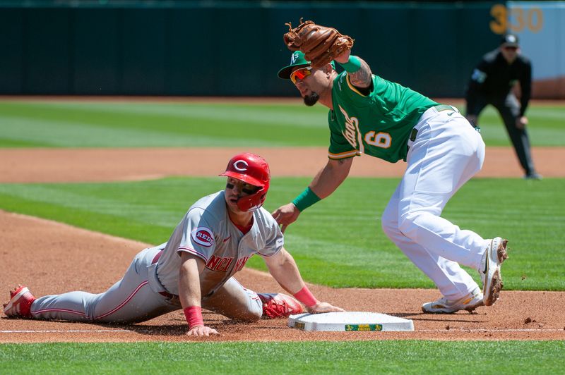 Apr 29, 2023; Oakland, California, USA; Oakland Athletics third baseman Jace Peterson (6) tags out Cincinnati Reds first baseman Spencer Steer (7) at third base during the first inning at RingCentral Coliseum. Mandatory Credit: Ed Szczepanski-USA TODAY Sports