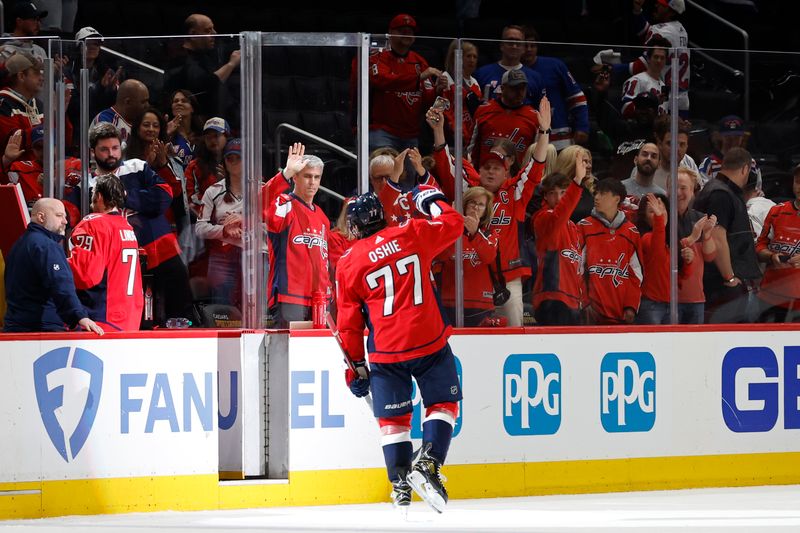 Apr 28, 2024; Washington, District of Columbia, USA; Washington Capitals right wing T.J. Oshie (77) waves to the fans while leaving the ice after the Capitals' game against the New York Rangers in game four of the first round of the 2024 Stanley Cup Playoffs at Capital One Arena. Mandatory Credit: Geoff Burke-USA TODAY Sports