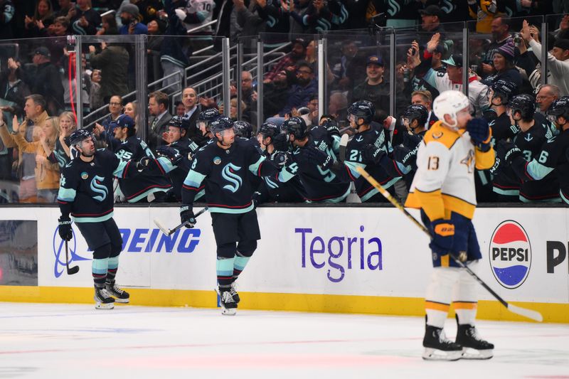 Nov 2, 2023; Seattle, Washington, USA; Seattle Kraken defenseman Brian Dumoulin (8) celebrates with the bench after scoring a goal against the Nashville Predators during the second period at Climate Pledge Arena. Mandatory Credit: Steven Bisig-USA TODAY Sports