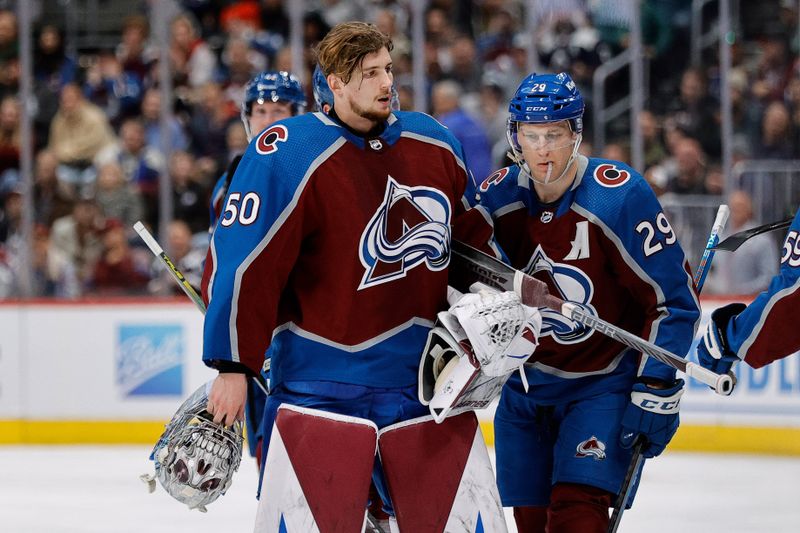 Jan 6, 2024; Denver, Colorado, USA; Colorado Avalanche goaltender Ivan Prosvetov (50) comes off the ice ahead of center Nathan MacKinnon (29) in the second period against the Florida Panthers at Ball Arena. Mandatory Credit: Isaiah J. Downing-USA TODAY Sports