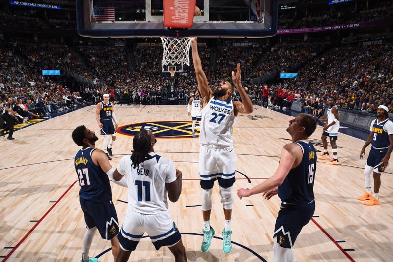 DENVER, CO - APRIL 10: Rudy Gobert #27 of the Minnesota Timberwolves drives to the basket during the game against the Denver Nuggets on April 10, 2024 at the Ball Arena in Denver, Colorado. NOTE TO USER: User expressly acknowledges and agrees that, by downloading and/or using this Photograph, user is consenting to the terms and conditions of the Getty Images License Agreement. Mandatory Copyright Notice: Copyright 2024 NBAE (Photo by Garrett Ellwood/NBAE via Getty Images)