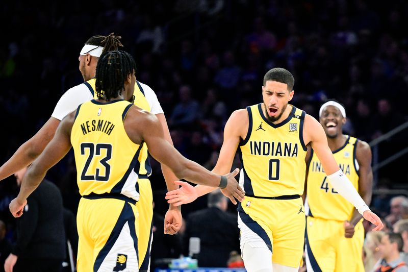 NEW YORK, NEW YORK - FEBRUARY 10:  Tyrese Haliburton #0 of the Indiana Pacers celebrates a basket with Aaron Nesmith #23 against the New York Knicks during the second half at Madison Square Garden on February 10, 2024 in New York City. NOTE TO USER: User expressly acknowledges and agrees that, by downloading and or using this photograph, User is consenting to the terms and conditions of the Getty Images License Agreement. (Photo by Steven Ryan/Getty Images)