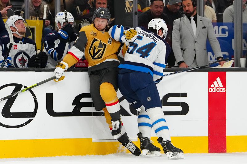 Nov 2, 2023; Las Vegas, Nevada, USA; Winnipeg Jets defenseman Dylan Samberg (54) checks Vegas Golden Knights center William Karlsson (71) during the first period at T-Mobile Arena. Mandatory Credit: Stephen R. Sylvanie-USA TODAY Sports