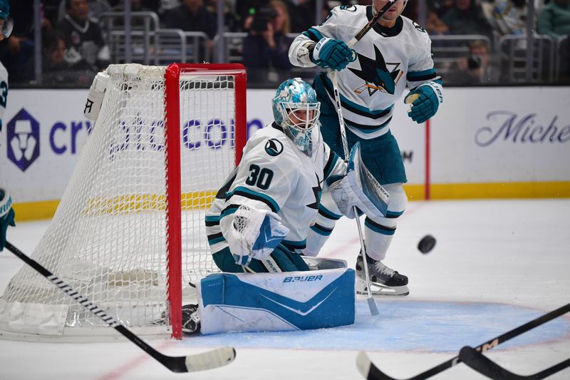 Jan 7, 2026; Los Angeles, California, USA; San Jose Sharks goaltender Yaroslav Askarov (30) defends teh goal against the Los Angeles Kings during the second period at Crypto.com Arena. Mandatory Credit: Gary A. Vasquez-Imagn Images