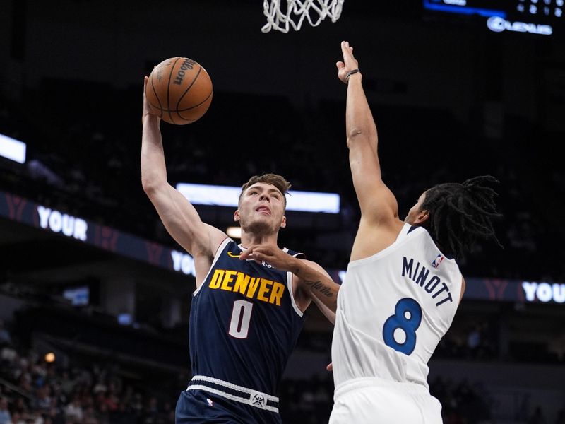 MINNEAPOLIS, MN - OCTOBER 17: Christian Braun #0 of the Denver Nuggets dunks the ball during the game against the Minnesota Timberwolves during a NBA Preseason game on October 17, 2024 at Target Center in Minneapolis, Minnesota. NOTE TO USER: User expressly acknowledges and agrees that, by downloading and or using this Photograph, user is consenting to the terms and conditions of the Getty Images License Agreement. Mandatory Copyright Notice: Copyright 2024 NBAE (Photo by Jordan Johnson/NBAE via Getty Images)