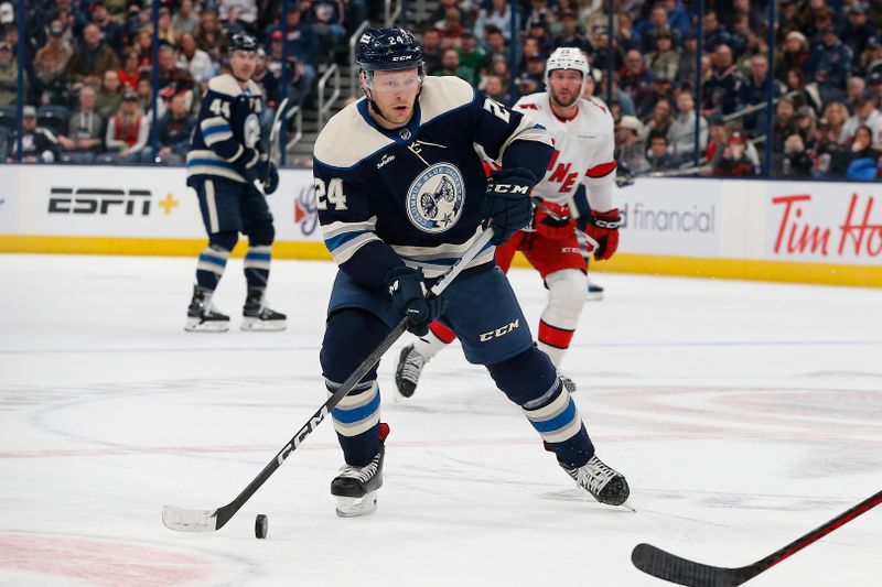 Feb 29, 2024; Columbus, Ohio, USA; Columbus Blue Jackets right wing Mathieu Olivier (24) carries the puck against the Carolina Hurricanes during the first period at Nationwide Arena. Mandatory Credit: Russell LaBounty-USA TODAY Sports