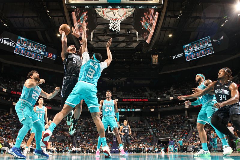 CHARLOTTE, NC - APRIL 5: Paolo Banchero #5 of the Orlando Magic shoots the ball during the game against the Charlotte Hornets on April 5, 2024 at Spectrum Center in Charlotte, North Carolina. NOTE TO USER: User expressly acknowledges and agrees that, by downloading and or using this photograph, User is consenting to the terms and conditions of the Getty Images License Agreement. Mandatory Copyright Notice: Copyright 2024 NBAE (Photo by Kent Smith/NBAE via Getty Images)