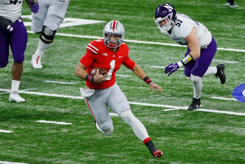 Dec 19, 2020; Indianapolis, IN, USA;  Ohio State Buckeyes quarterback Justin Fields (1) rushes up field ahead of Northwestern Wildcats linebacker Blake Gallagher (51) during the first quarter of the Big Ten Championship football game at Lucas Oil Stadium in Indianapolis on Saturday, Dec. 19, 2020.  Mandatory Credit: Adam Cairns-USA TODAY NETWORK