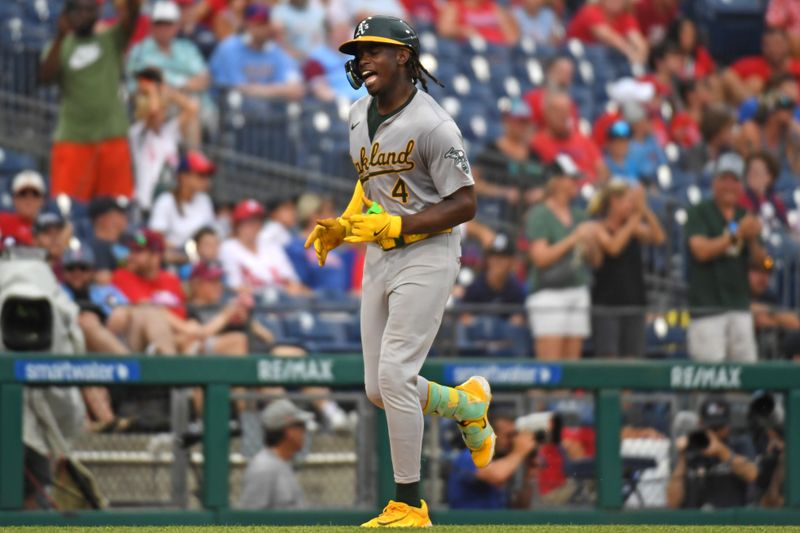 Jul 14, 2024; Philadelphia, Pennsylvania, USA; Oakland Athletics outfielder Lawrence Butler (4) celebrates his third home run of the game against the Philadelphia Phillies during the seventh inning at Citizens Bank Park. Mandatory Credit: Eric Hartline-USA TODAY Sports