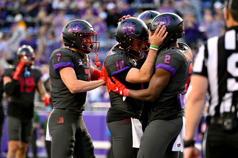 Nov 18, 2023; Fort Worth, Texas, USA; TCU Horned Frogs running back Trey Sanders (2) and quarterback Josh Hoover (10) and wide receiver JP Richardson (7) celebrates after Sanders scores a touchdown against the Baylor Bears during the second half at Amon G. Carter Stadium. Mandatory Credit: Jerome Miron-USA TODAY Sports