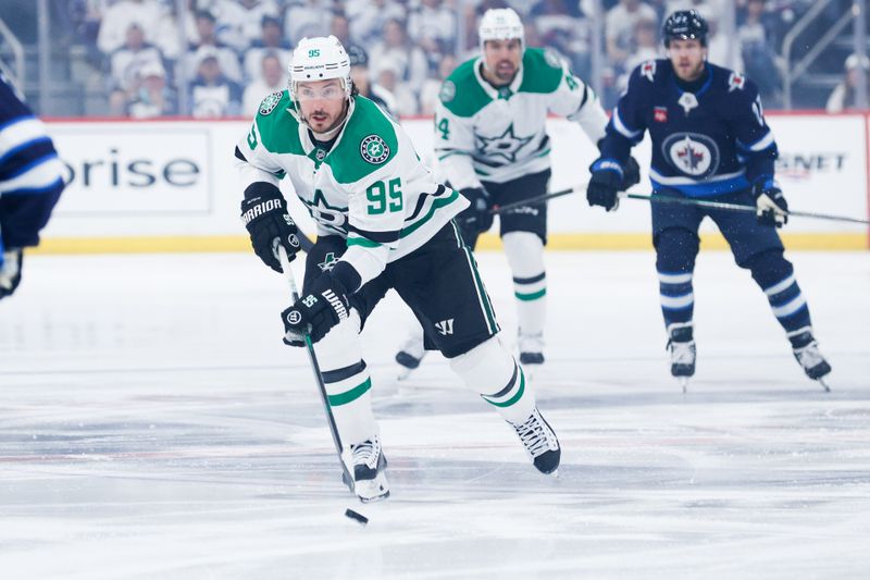 May 7, 2025; Winnipeg, Manitoba, CAN; Dallas Stars forward Matt Duchene (95) skates into the Winnipeg Jets during the first period in game one of the second round of the 2025 Stanley Cup Playoffs at Canada Life Centre. Mandatory Credit: Terrence Lee-Imagn Images