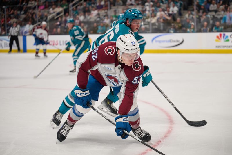 Oct 20, 2024; San Jose, California, USA; Colorado Avalanche center Ivan Ivan (82) fights for position against San Jose Sharks defenseman Jack Thompson (26) during the first period at SAP Center at San Jose. Mandatory Credit: Robert Edwards-Imagn Images